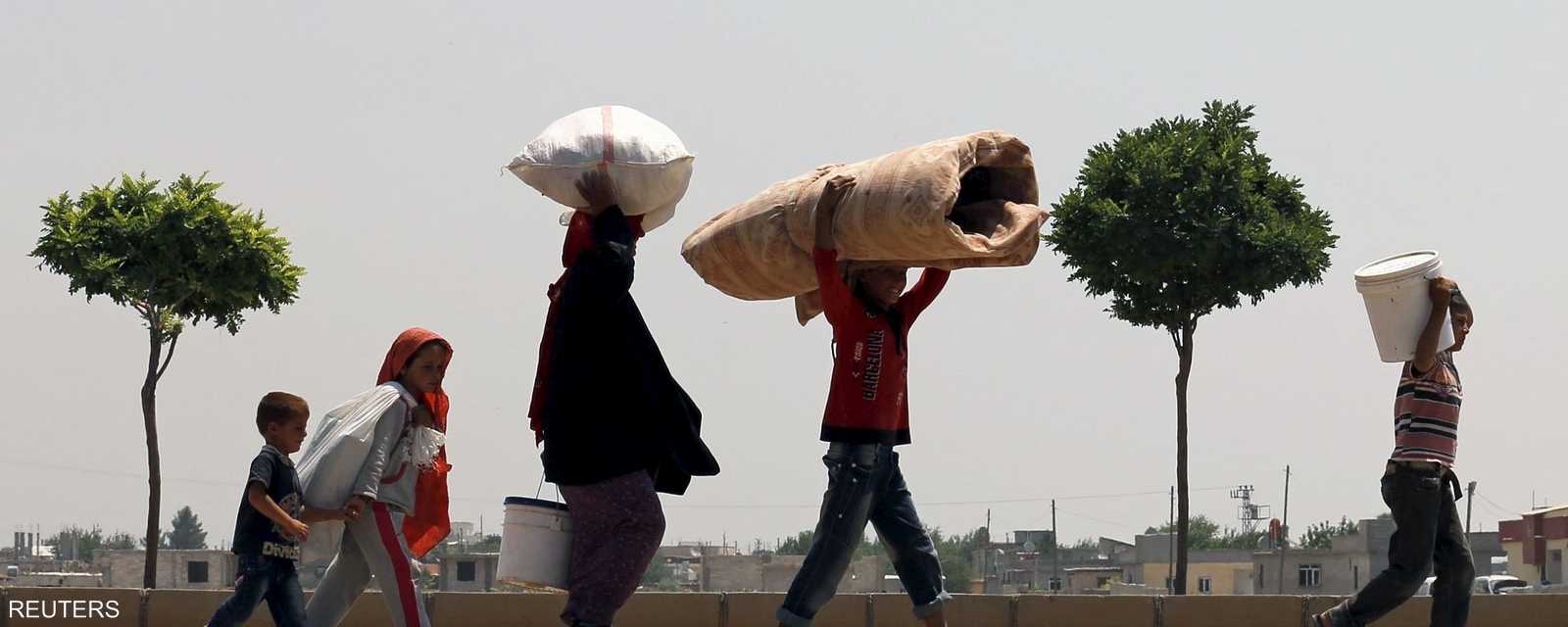 المعارك في تل أبيض أدت إلى نزوح نحو 23 ألف سوري إلى تركيا