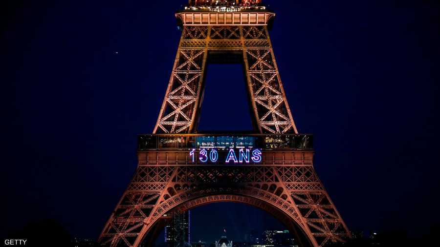 "130 عاما" كتبت وسط البرج المعروق بـ"برج المرأة الحديدية"